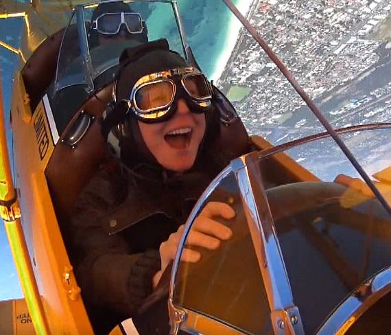 Checkout our recent commercial Tigermoth Adventure Flights image of girl in open cockpit